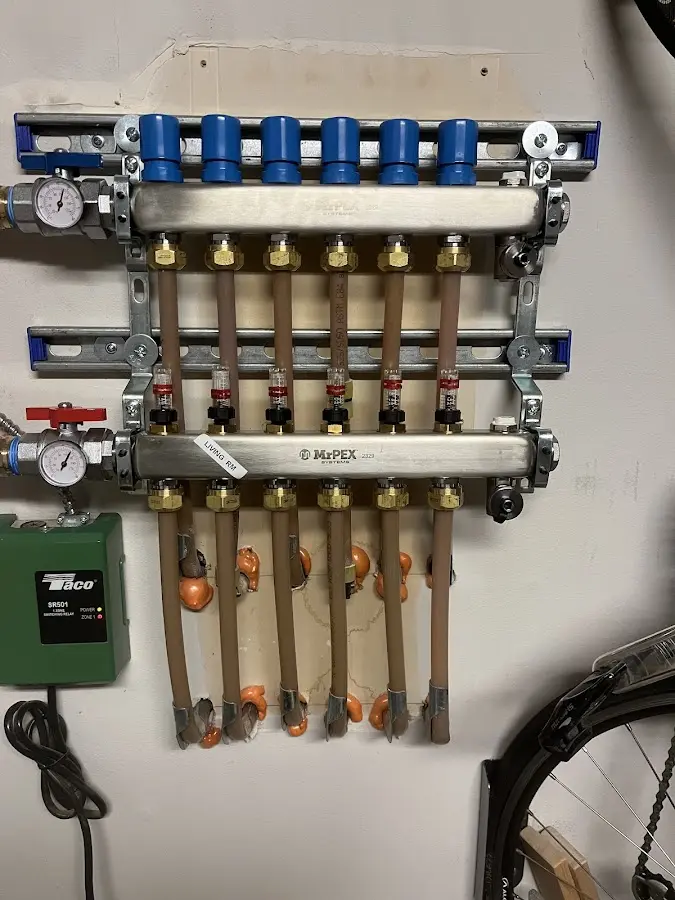 Plumber performing Water Heater Repair at a residential property in Hartland