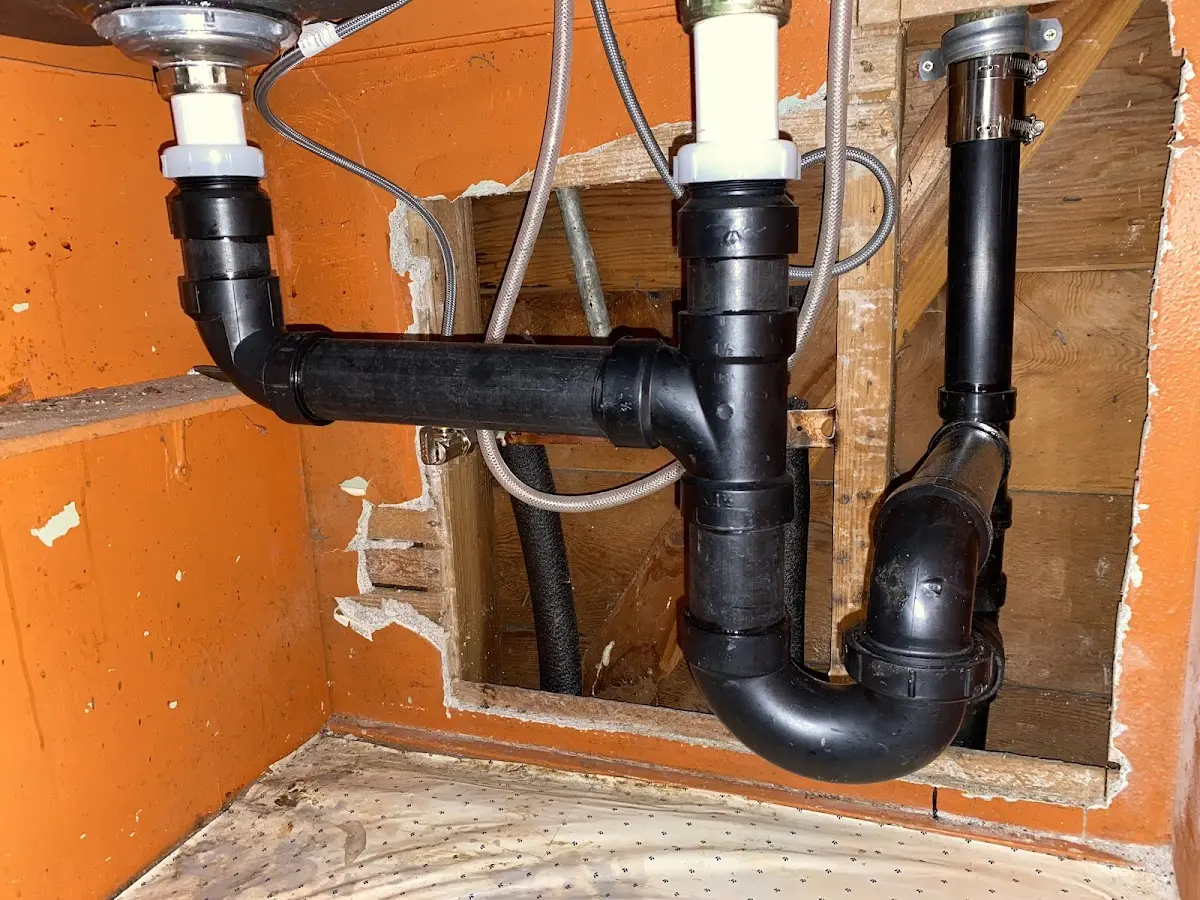 Professional Garbage Disposal Repair equipment and tools on the job in Hartland